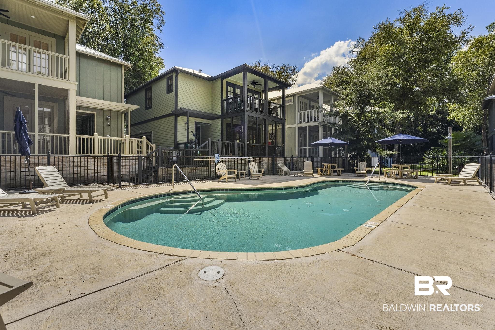 25773 Canal Road Orange Beach, AL 36561 - Photo 9 of 32 Community pool with a patio area, a balcony, and ceiling fan