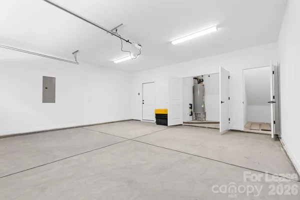 a view of a storage & utility room with two washing machine