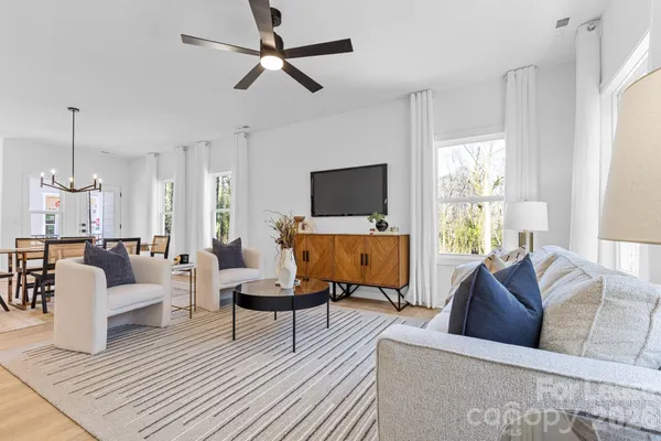 a living room with furniture and a flat screen tv