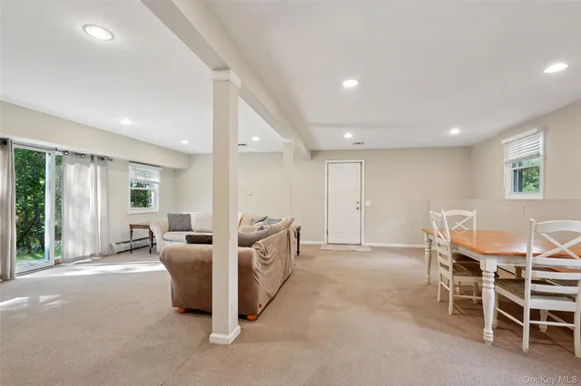 a view of a dining room with furniture window and outside view