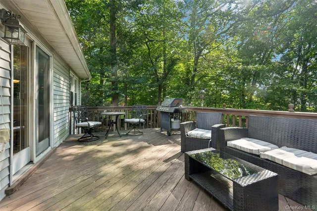 a view of a patio with a table and chairs