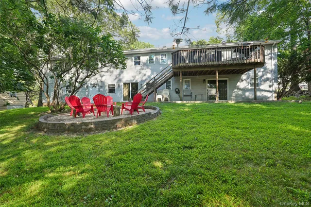 a view of front of house with an outdoor seating
