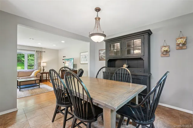 a view of a dining room with furniture window and outside view