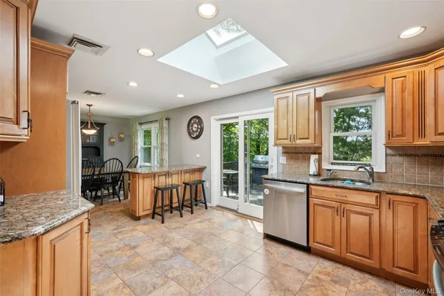 a kitchen with sink cabinets and dining table
