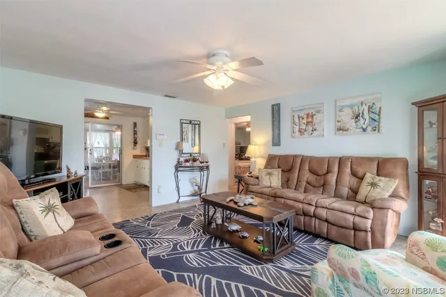 a living room with a couch and a flat screen tv