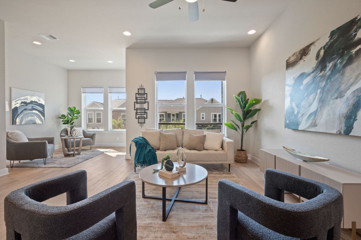 2510 Doc Reeves Street Austin, TX 78723 - Photo 11 of 39 a living room with furniture and a potted plant