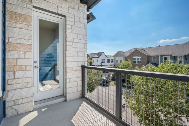 a view of a balcony with a pot