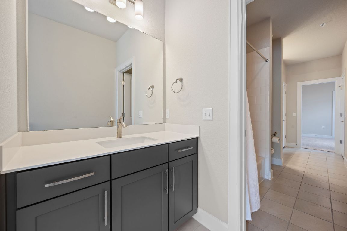 2510 Doc Reeves Street Austin, TX 78723 - Photo 30 of 39 a bathroom with a sink and a mirror