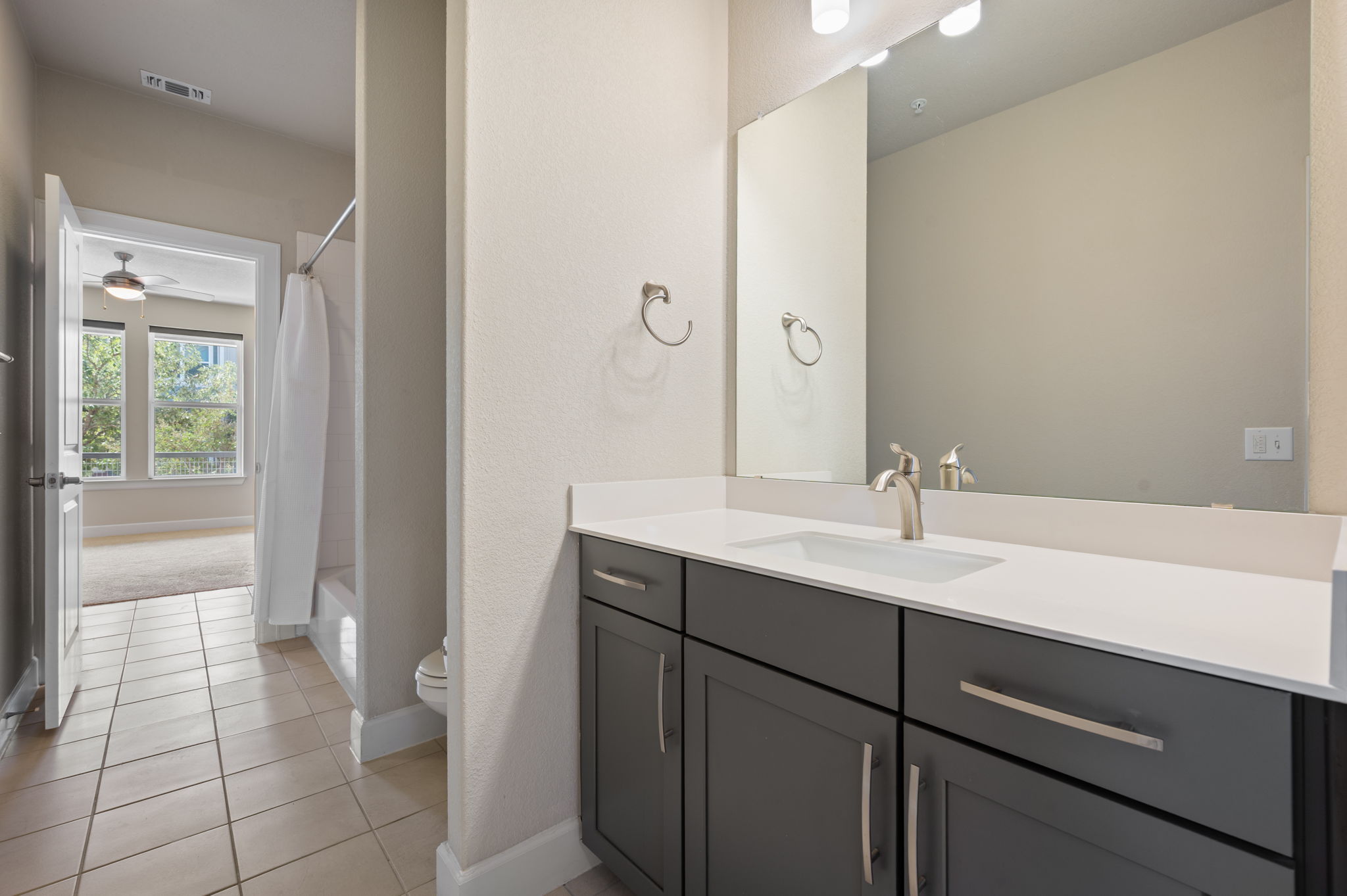 2510 Doc Reeves Street Austin, TX 78723 - Photo 31 of 39 a bathroom with a sink a toilet and a mirror