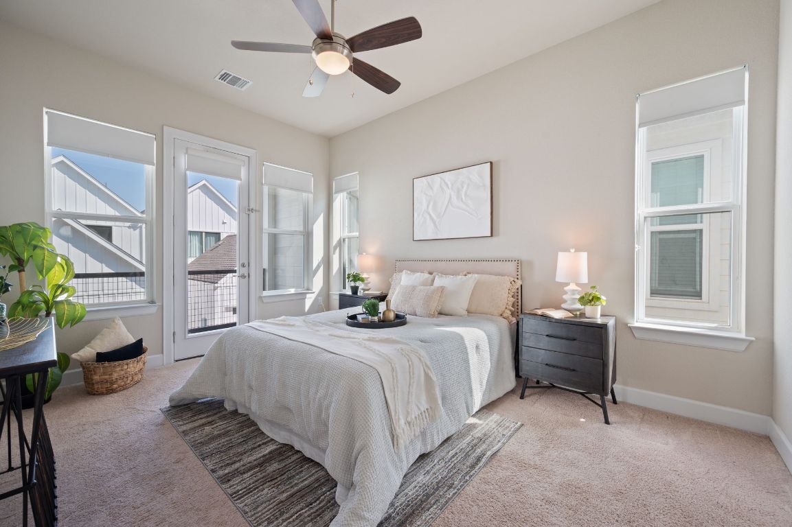 2510 Doc Reeves Street Austin, TX 78723 - Photo 5 of 39 a bedroom with a bed furniture and a window