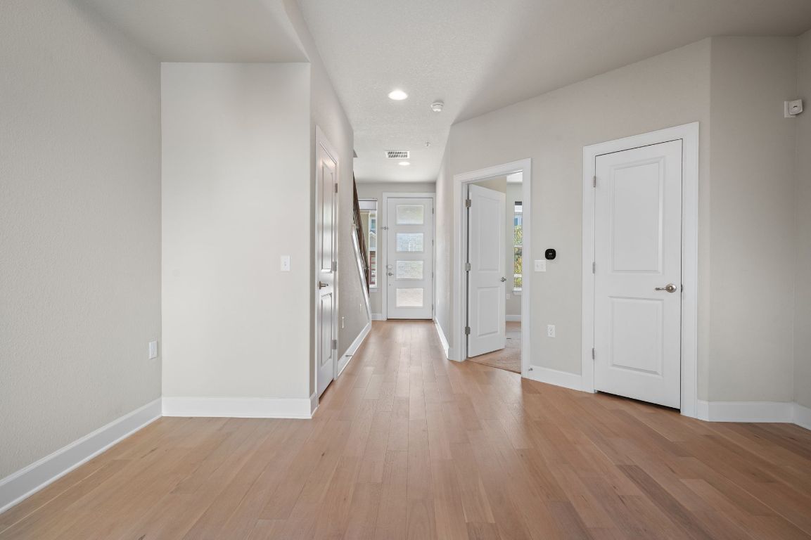 2510 Doc Reeves Street Austin, TX 78723 - Photo 7 of 39 a view of a hallway with wooden floor