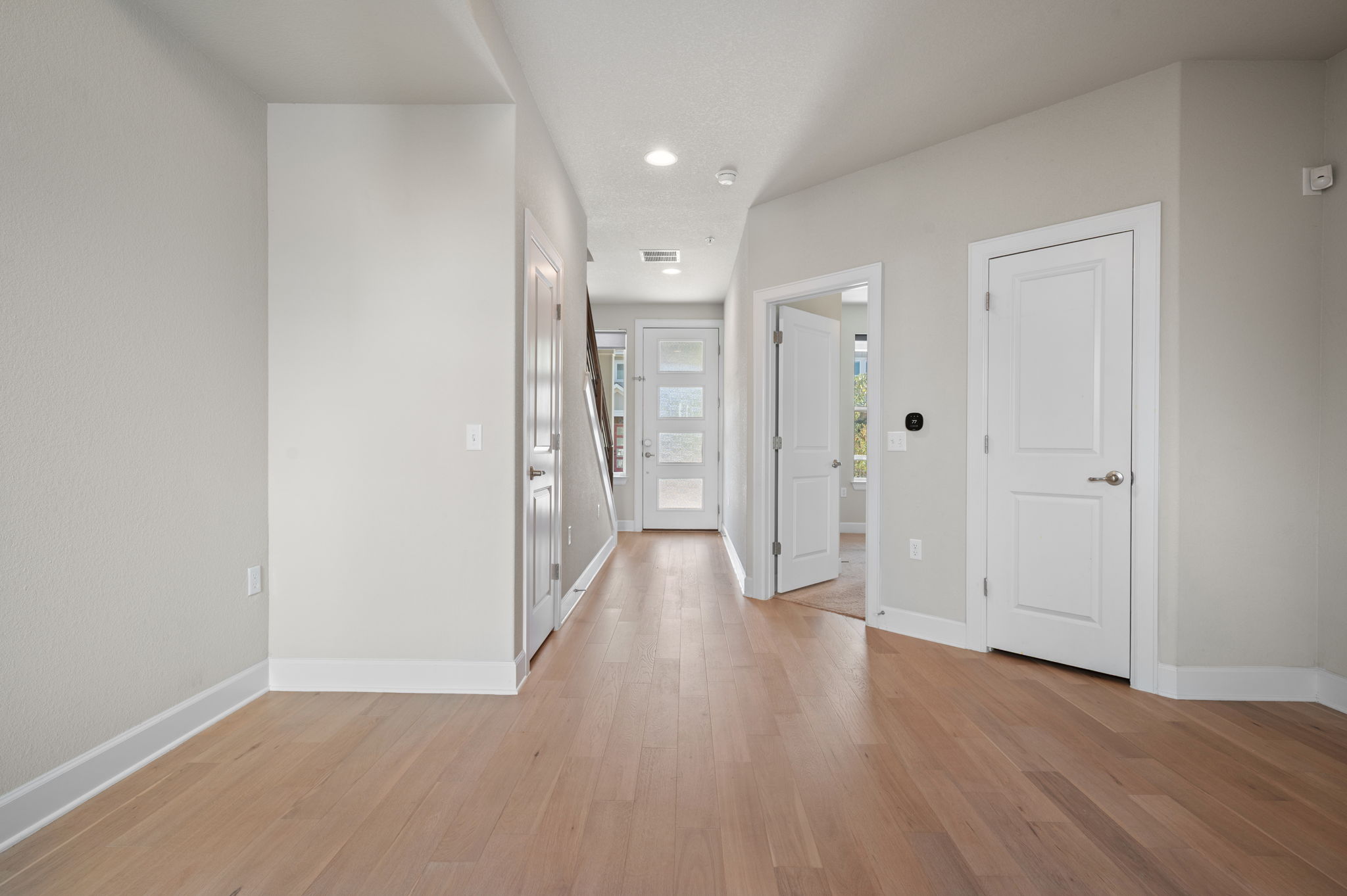 2510 Doc Reeves Street Austin, TX 78723 - Photo 7 of 39 a view of a hallway with wooden floor
