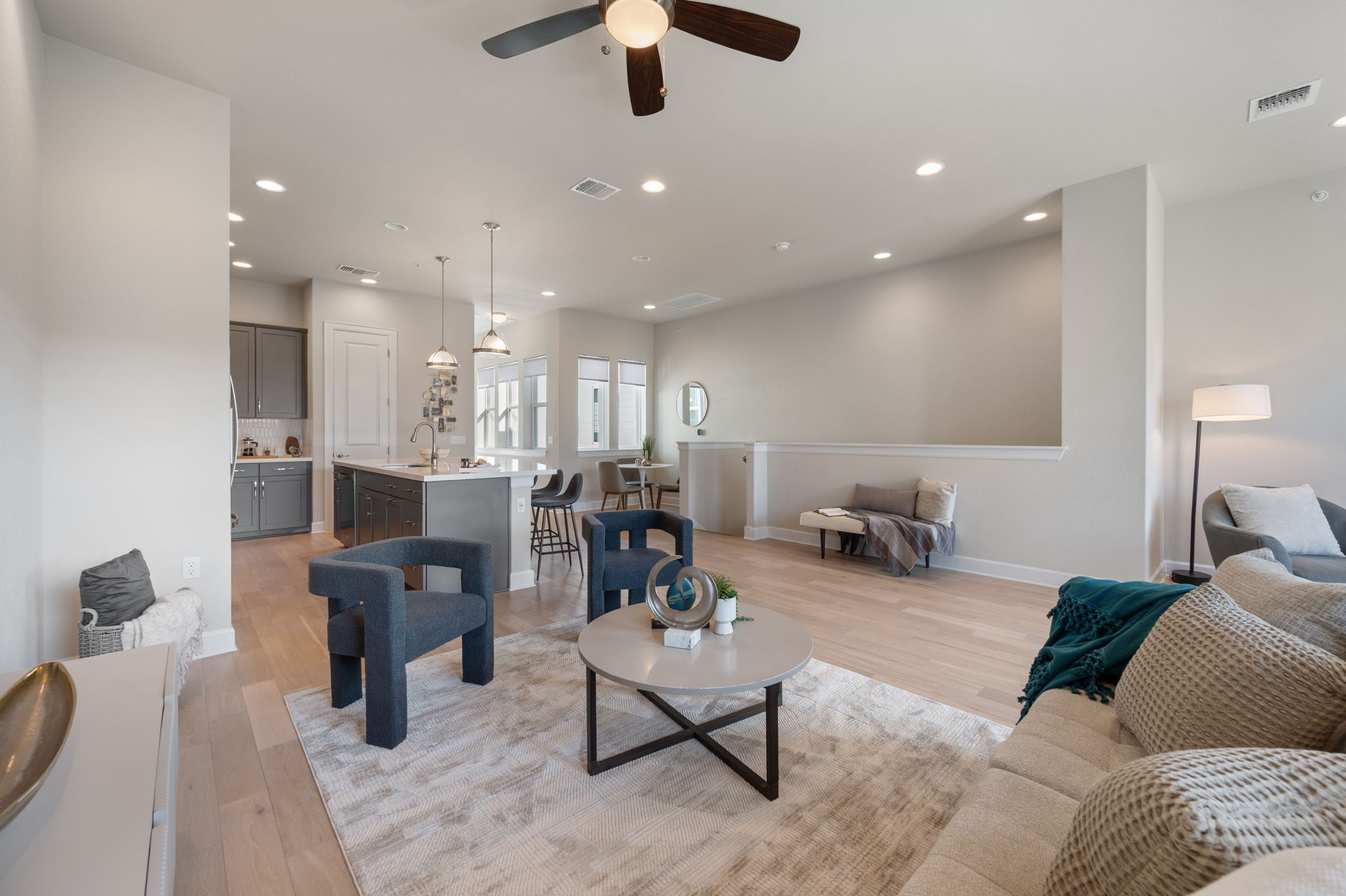 2510 Doc Reeves Street Austin, TX 78723 - Photo 10 of 39 a living room with furniture and a chandelier
