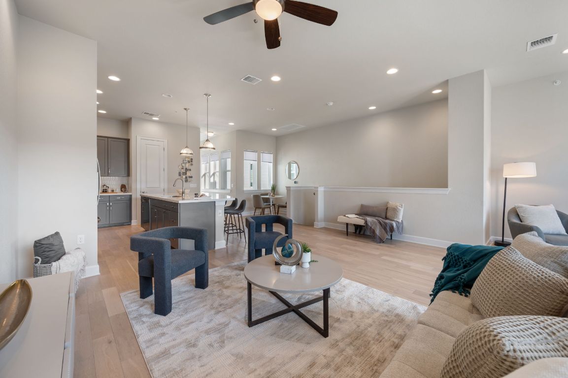 2510 Doc Reeves Street Austin, TX 78723 - Photo 10 of 39 a living room with furniture and a chandelier