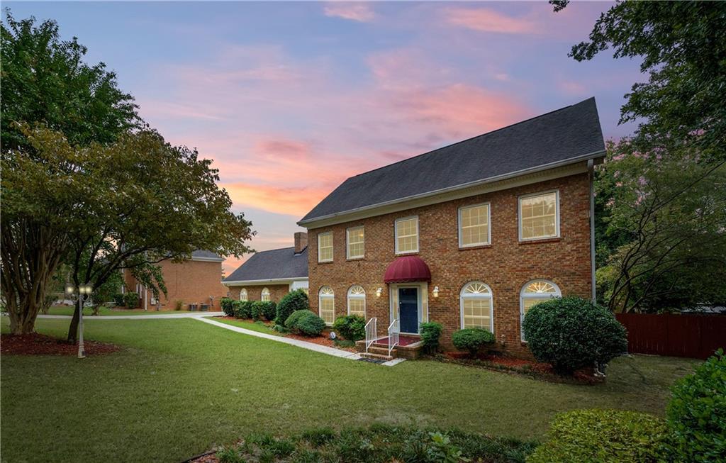 5573 Manassas Run Stone Mountain, GA 30087 - Photo 1 of 1 a front view of a house with a yard