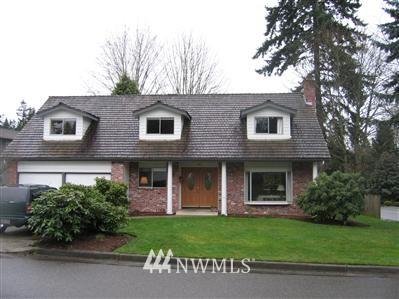 11801 Northeast 158th Street Bothell, WA 98011 - Photo 1 of 1 a front view of a house with a garden