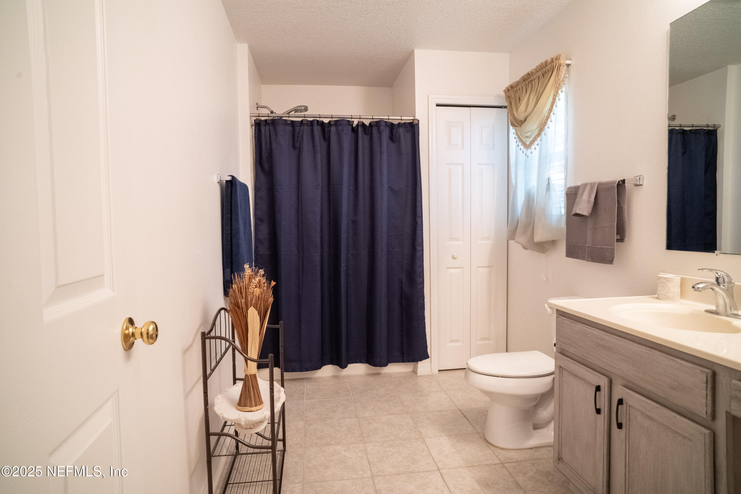 76391 Longleaf Loop Yulee, FL 32097 - Photo 15 of 58 a bathroom with a sink toilet and shower