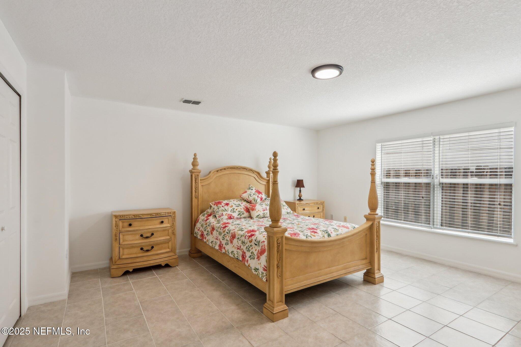 76391 Longleaf Loop Yulee, FL 32097 - Photo 17 of 58 Bedroom 1 down Stairs