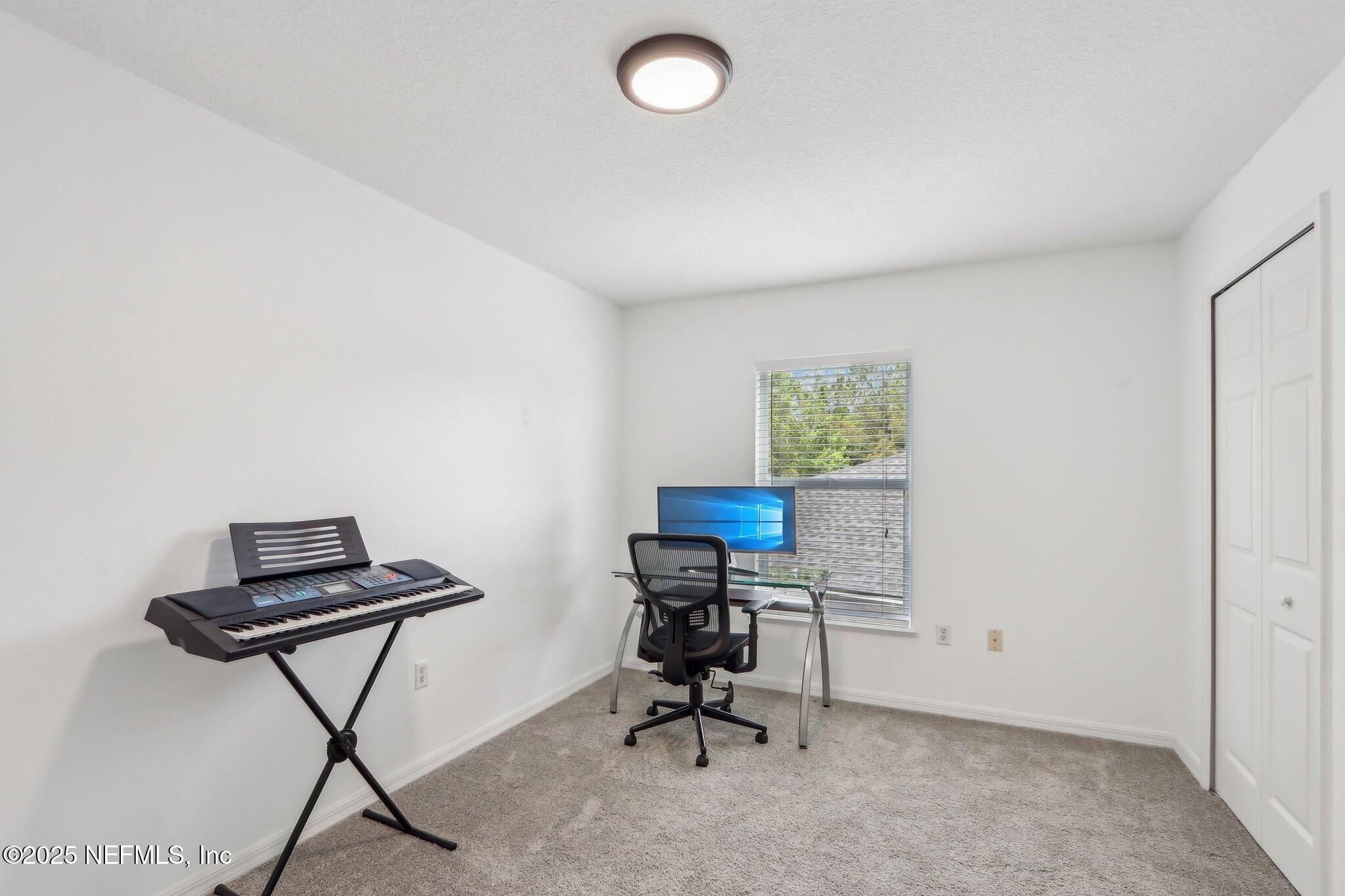 76391 Longleaf Loop Yulee, FL 32097 - Photo 23 of 58 a view of a workspace with furniture