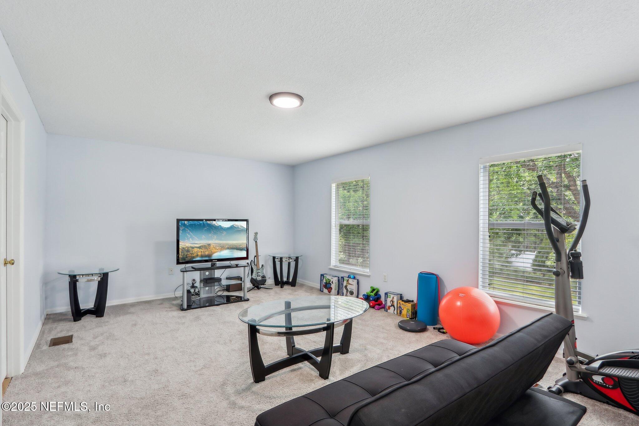 76391 Longleaf Loop Yulee, FL 32097 - Photo 26 of 58 a living room with furniture and a window
