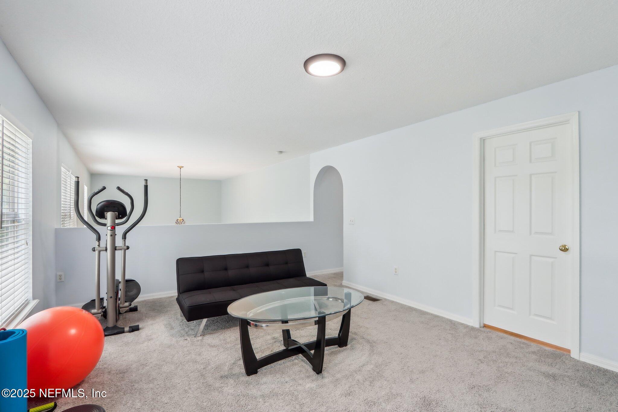 76391 Longleaf Loop Yulee, FL 32097 - Photo 27 of 58 a living room with furniture