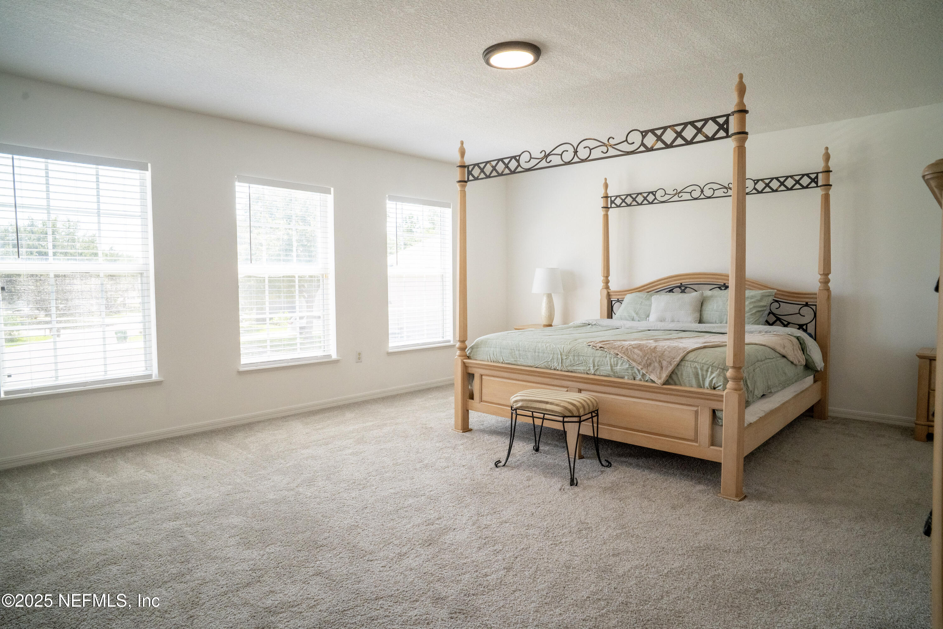 76391 Longleaf Loop Yulee, FL 32097 - Photo 28 of 58 a bedroom with furniture and a window