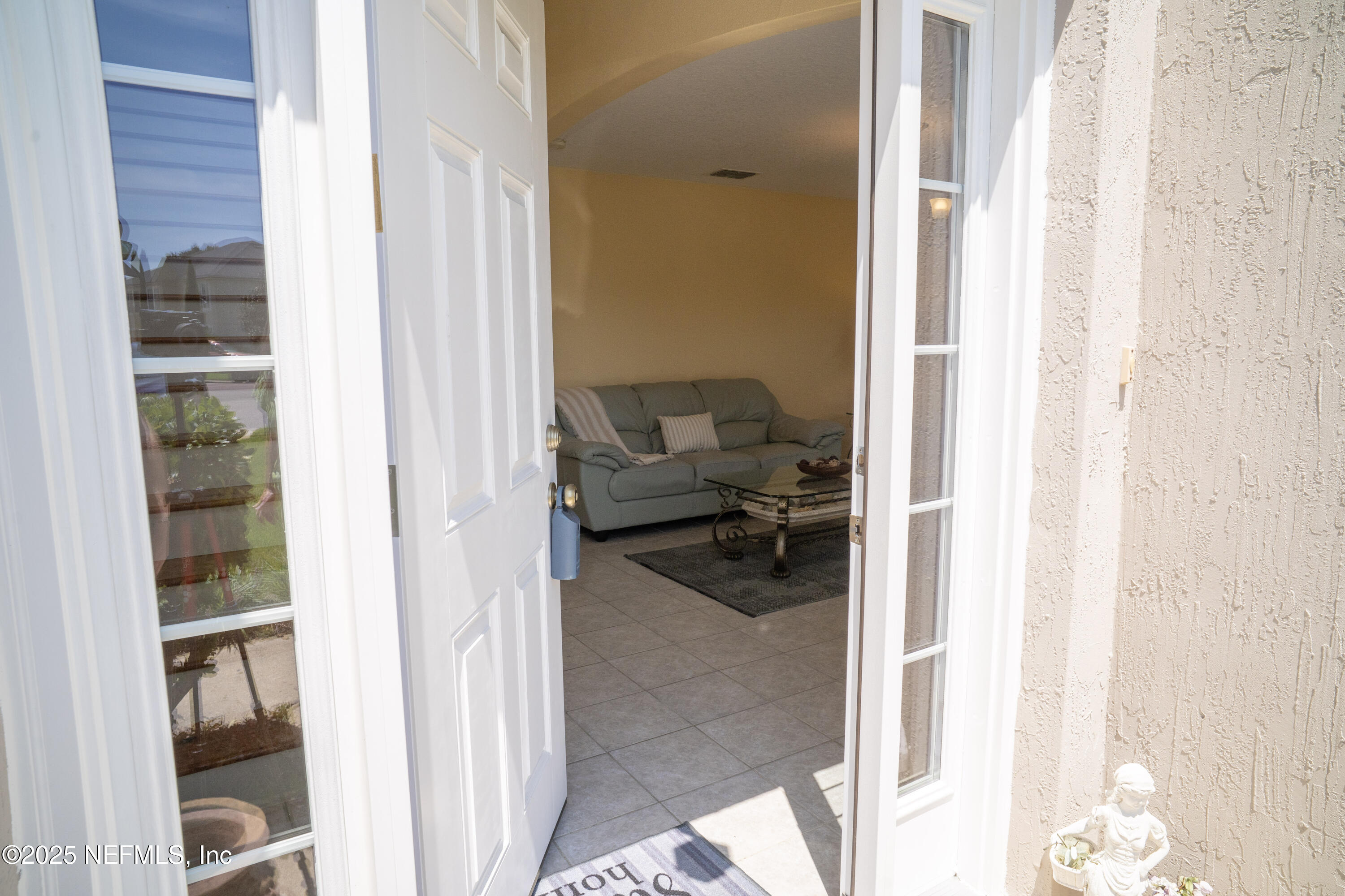 76391 Longleaf Loop Yulee, FL 32097 - Photo 5 of 58 a view of a bedroom from a hallway