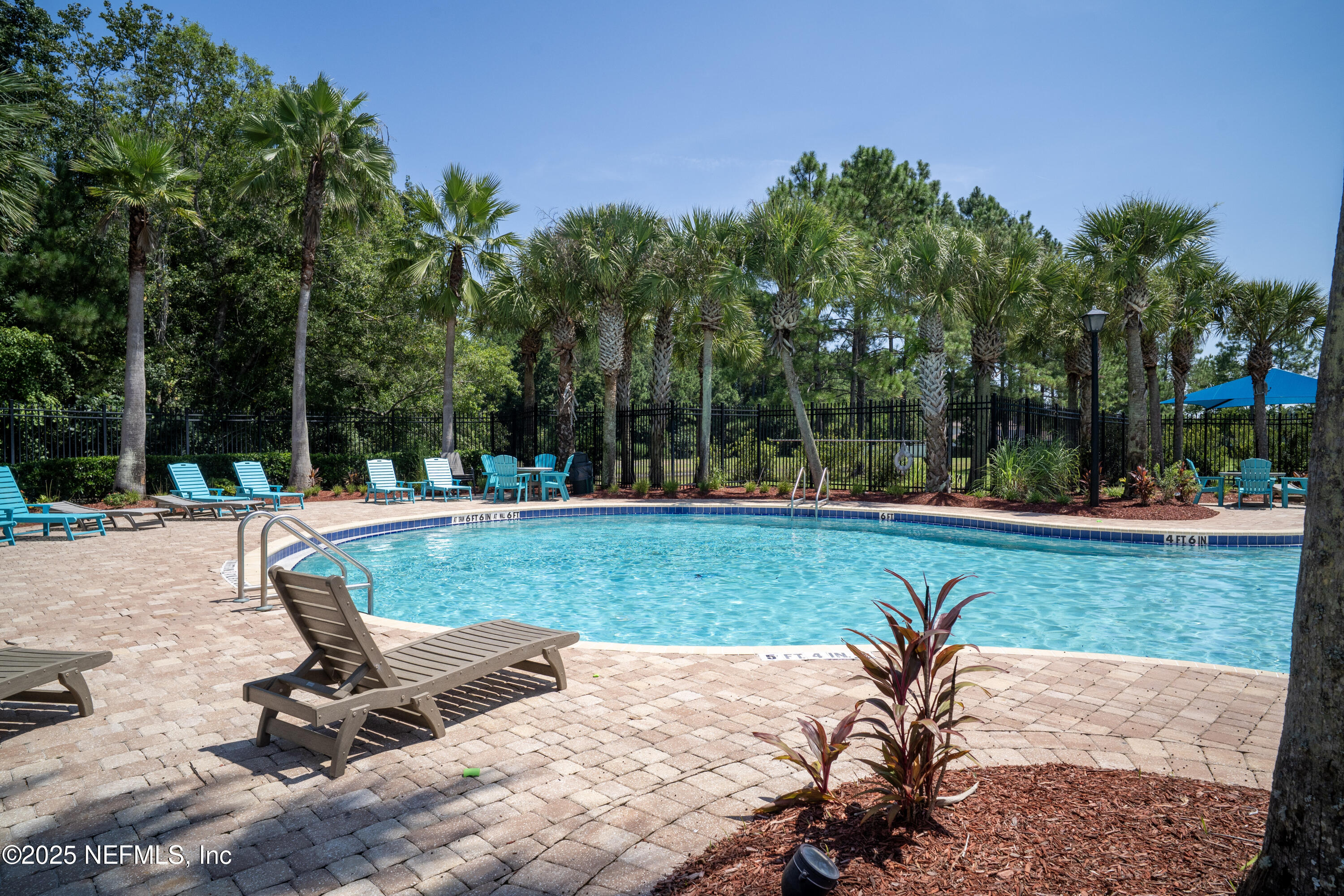 76391 Longleaf Loop Yulee, FL 32097 - Photo 54 of 58 a view of a backyard with sitting area