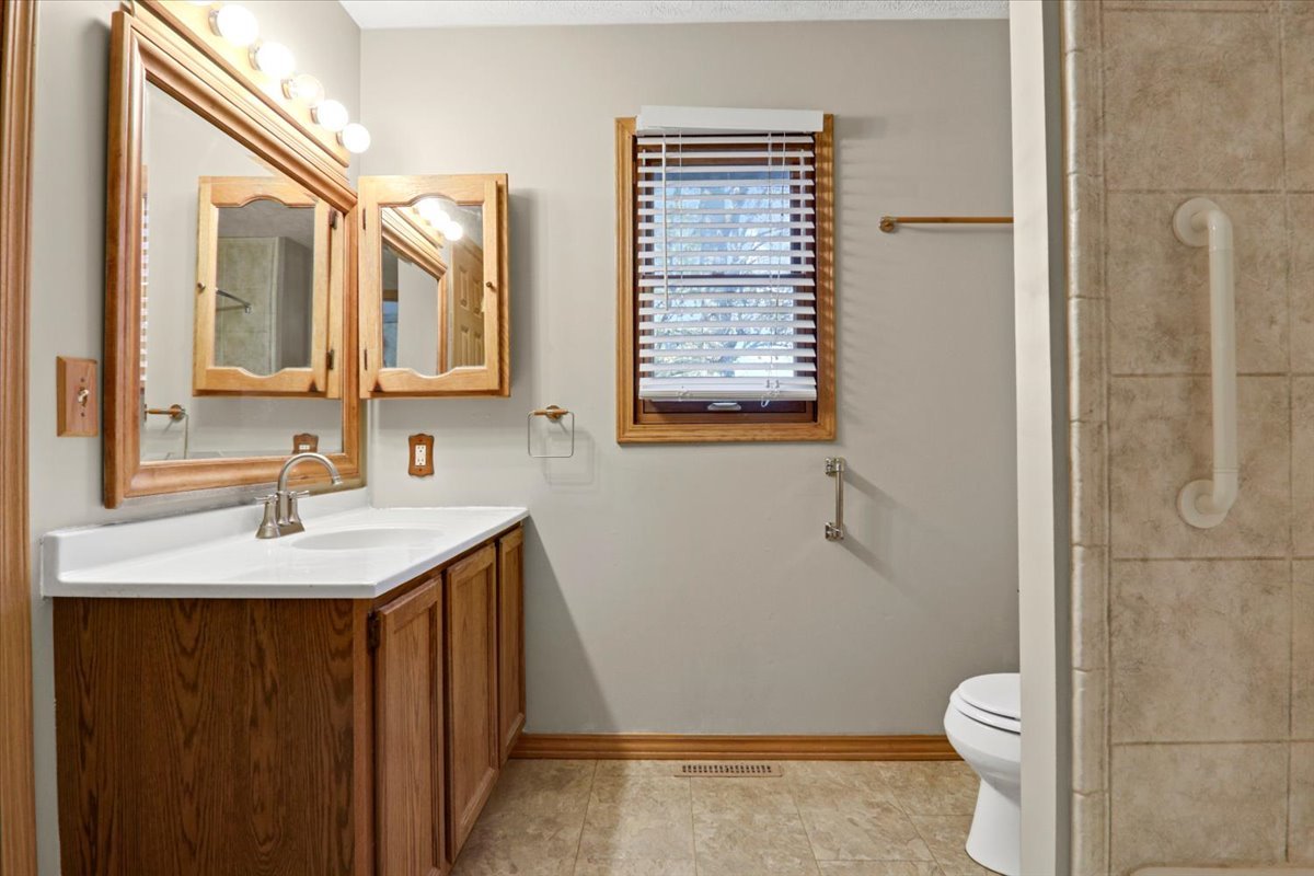 1720 Johnson Drive Normal, IL 61761 - Photo 14 of 23 a bathroom with a sink toilet and shower
