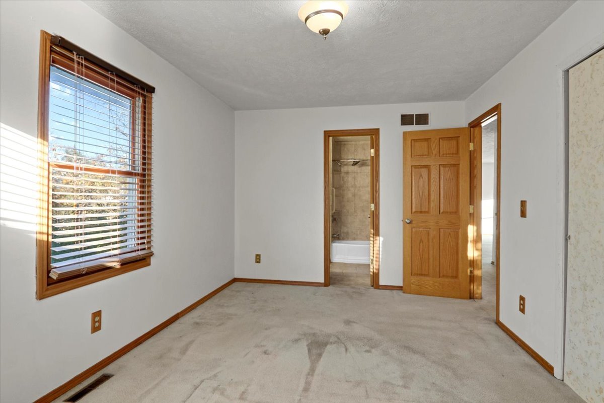 1720 Johnson Drive Normal, IL 61761 - Photo 9 of 23 a view of an empty room with window and closet area