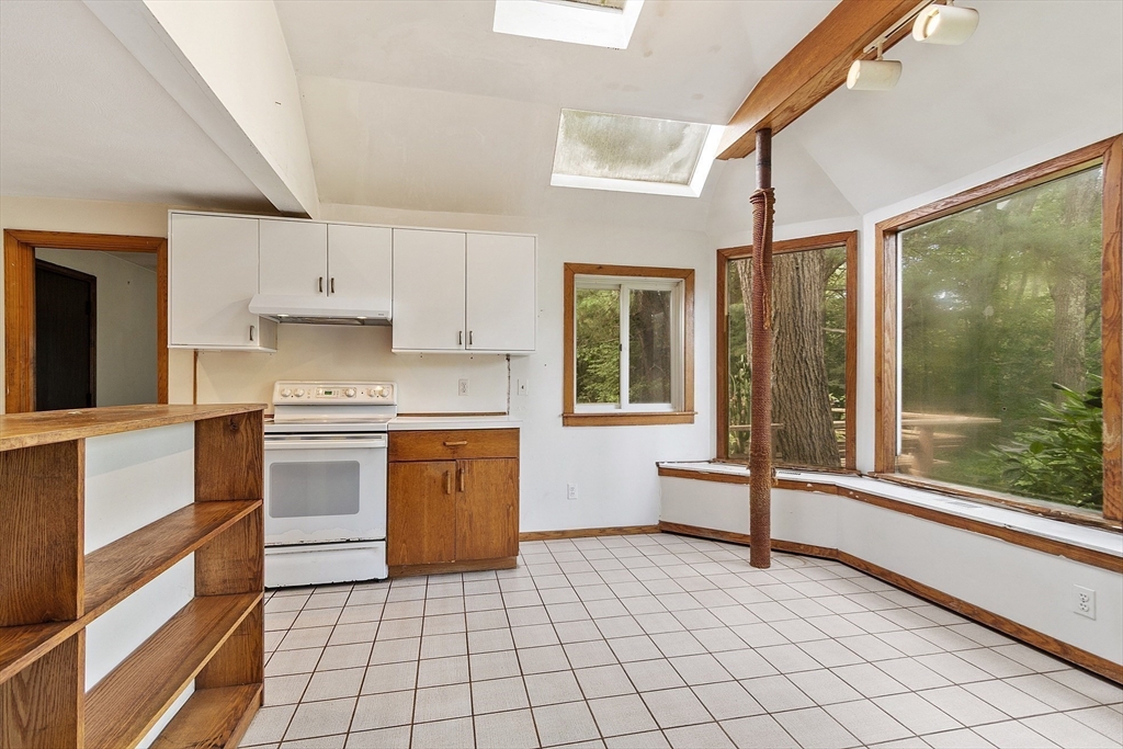 39 Winslow Street Concord, MA 01742 - Photo 5 of 22 a kitchen with a stove a sink and a refrigerator