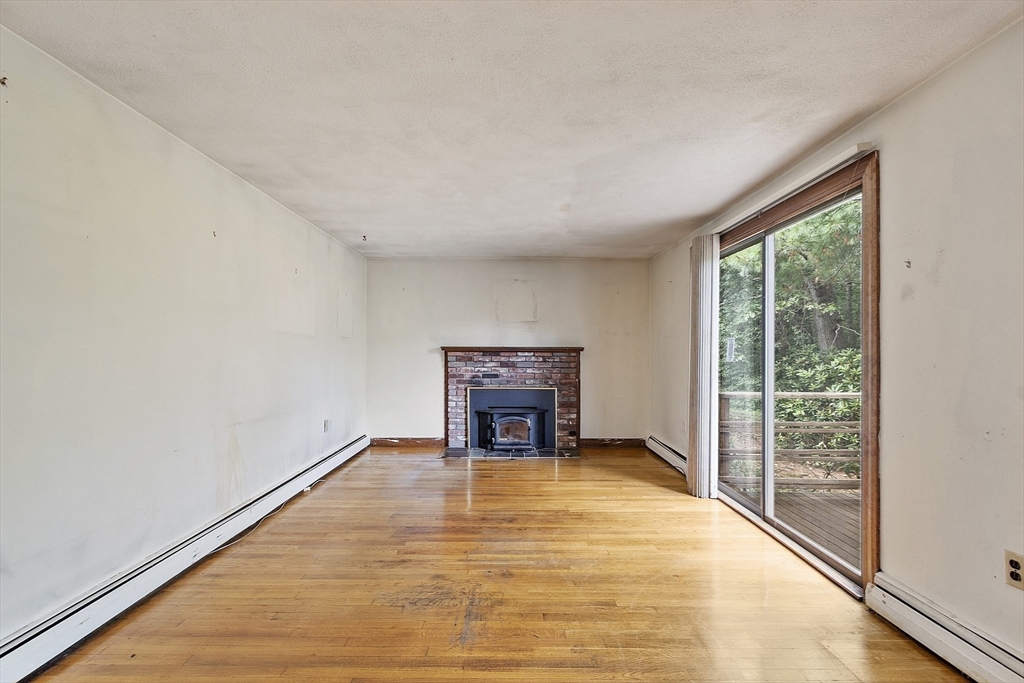 39 Winslow Street Concord, MA 01742 - Photo 8 of 22 a view of an empty room with a window