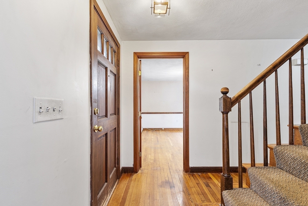 39 Winslow Street Concord, MA 01742 - Photo 10 of 22 a view of a livingroom with furniture and floor to ceiling window