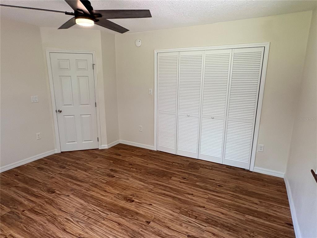 2110 Northwest 100th Street Ocala, FL 34475 - Photo 24 of 42 a view of empty room with wooden floor