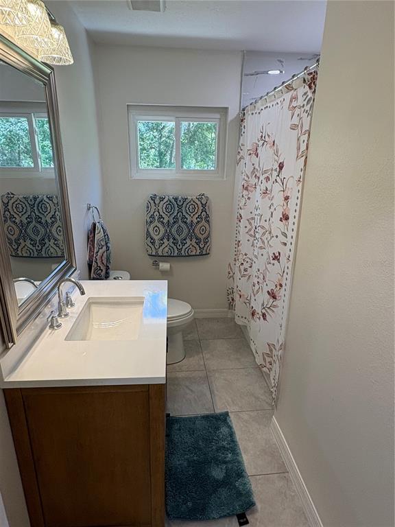 2110 Northwest 100th Street Ocala, FL 34475 - Photo 27 of 42 a bathroom with a sink and a mirror