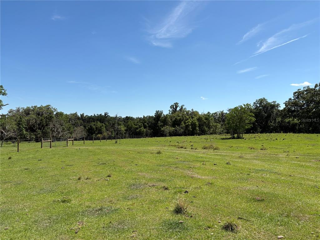 2110 Northwest 100th Street Ocala, FL 34475 - Photo 28 of 44 a view of an outdoor space and a yard