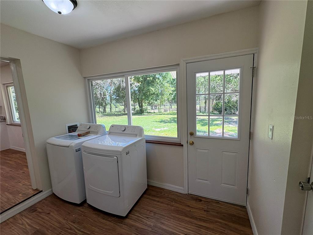 2110 Northwest 100th Street Ocala, FL 34475 - Photo 38 of 44 a view of a kitchen with wooden floor and floors