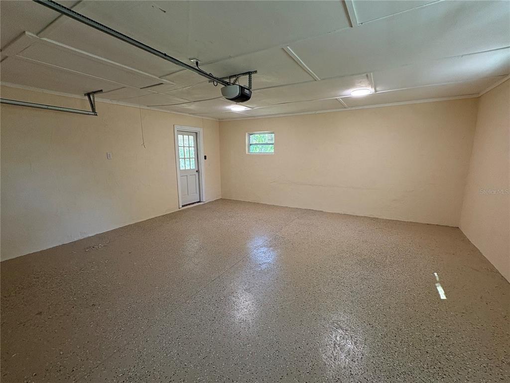 2110 Northwest 100th Street Ocala, FL 34475 - Photo 44 of 44 an empty room with stairs and windows