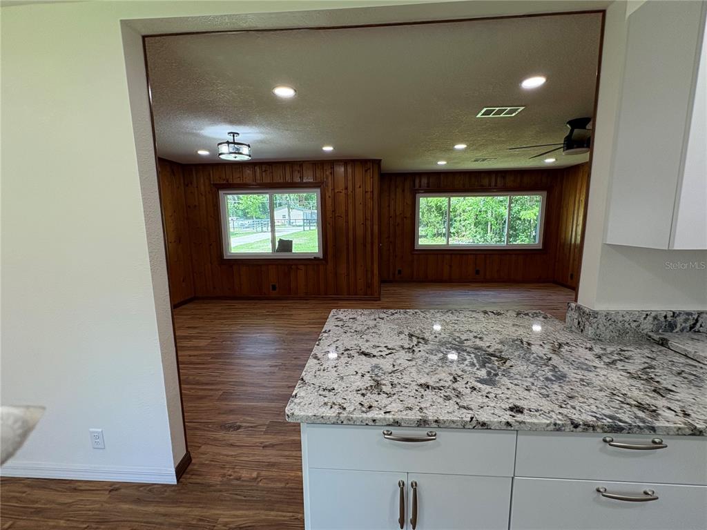 2110 Northwest 100th Street Ocala, FL 34475 - Photo 6 of 42 a view of a livingroom with window and wooden floor