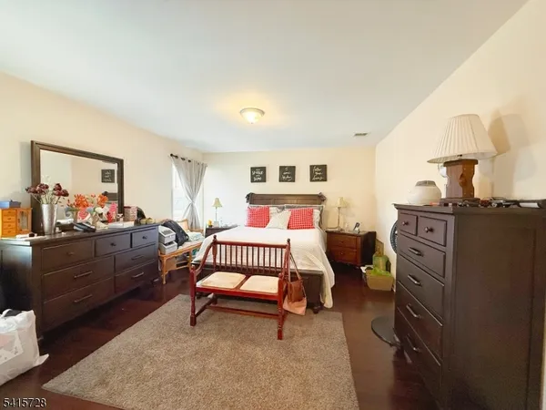 a bedroom with furniture and a bed