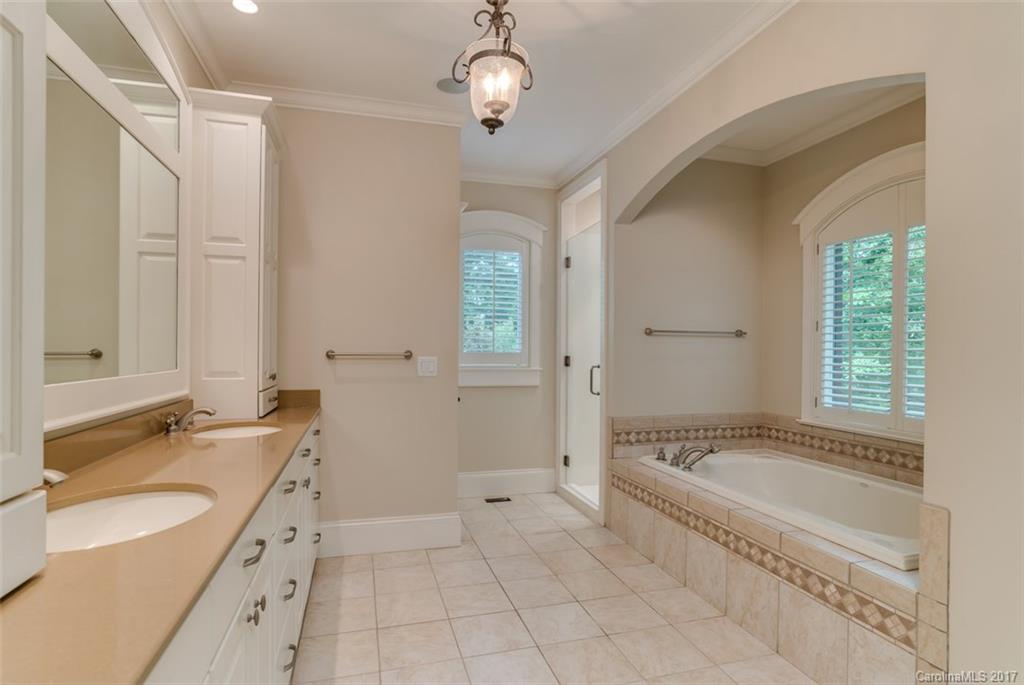 1322 Baber Road Rutherfordton, NC 28139 - Photo 12 of 24 a spacious bathroom with a granite countertop tub sink and mirror