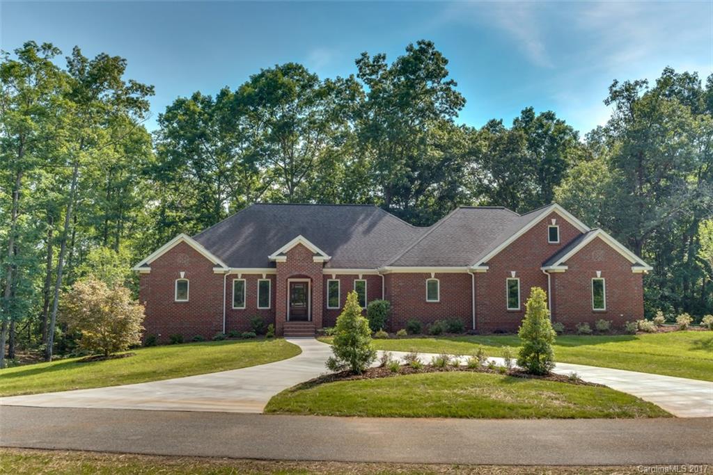 1322 Baber Road Rutherfordton, NC 28139 - Photo 22 of 24 a front view of a house with a garden
