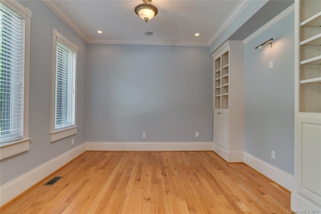 1322 Baber Road Rutherfordton, NC 28139 - Photo 4 of 24 an empty room with wooden floor and windows