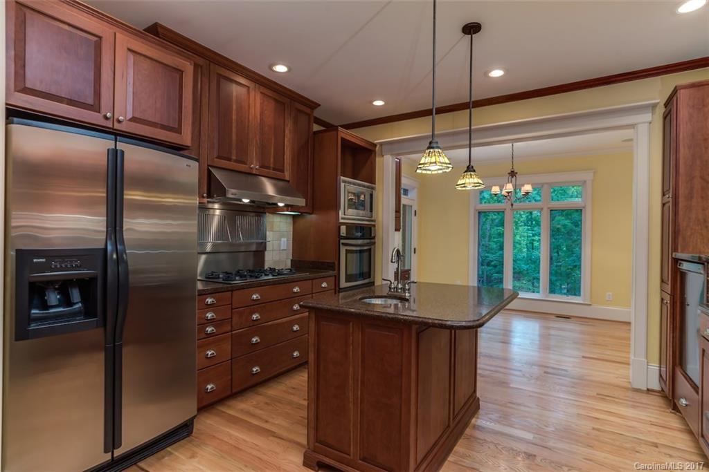 1322 Baber Road Rutherfordton, NC 28139 - Photo 6 of 24 a kitchen with kitchen island a counter space a sink appliances and cabinets