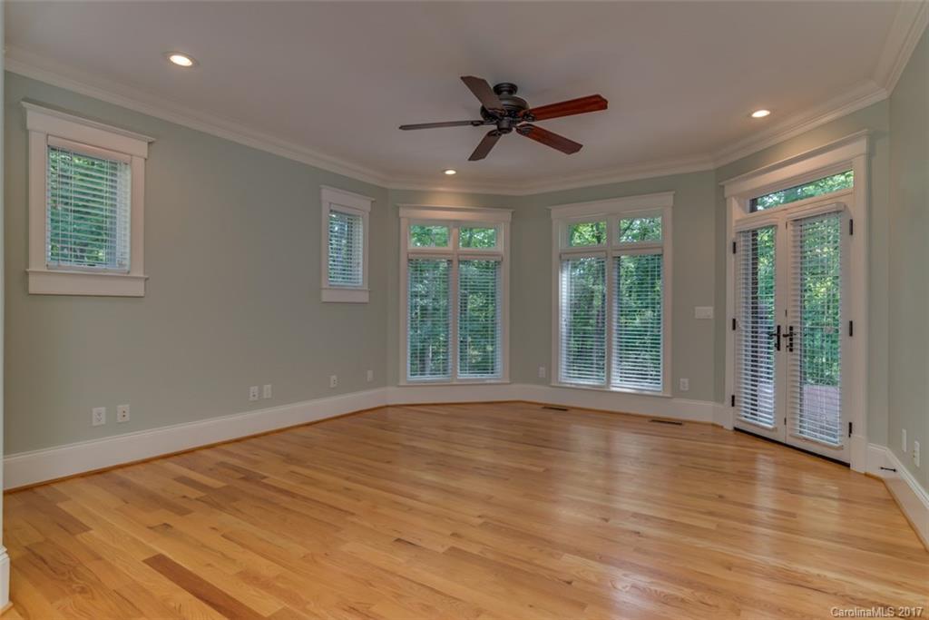1322 Baber Road Rutherfordton, NC 28139 - Photo 10 of 24 a view of an empty room with wooden floor and a window