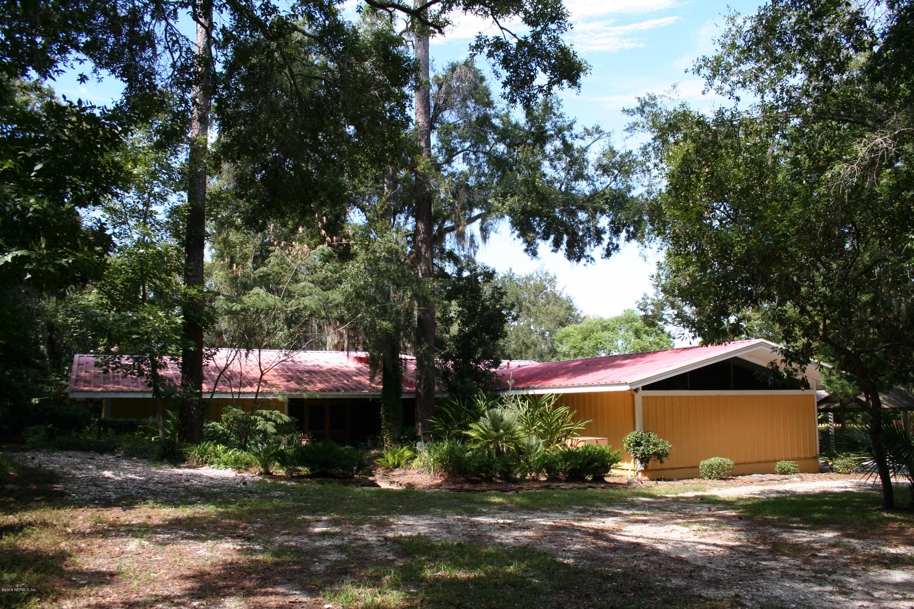 524 Vaill Point Road St. Augustine, FL 32086 - Photo 1 of 50 a front view of house with yard and trees