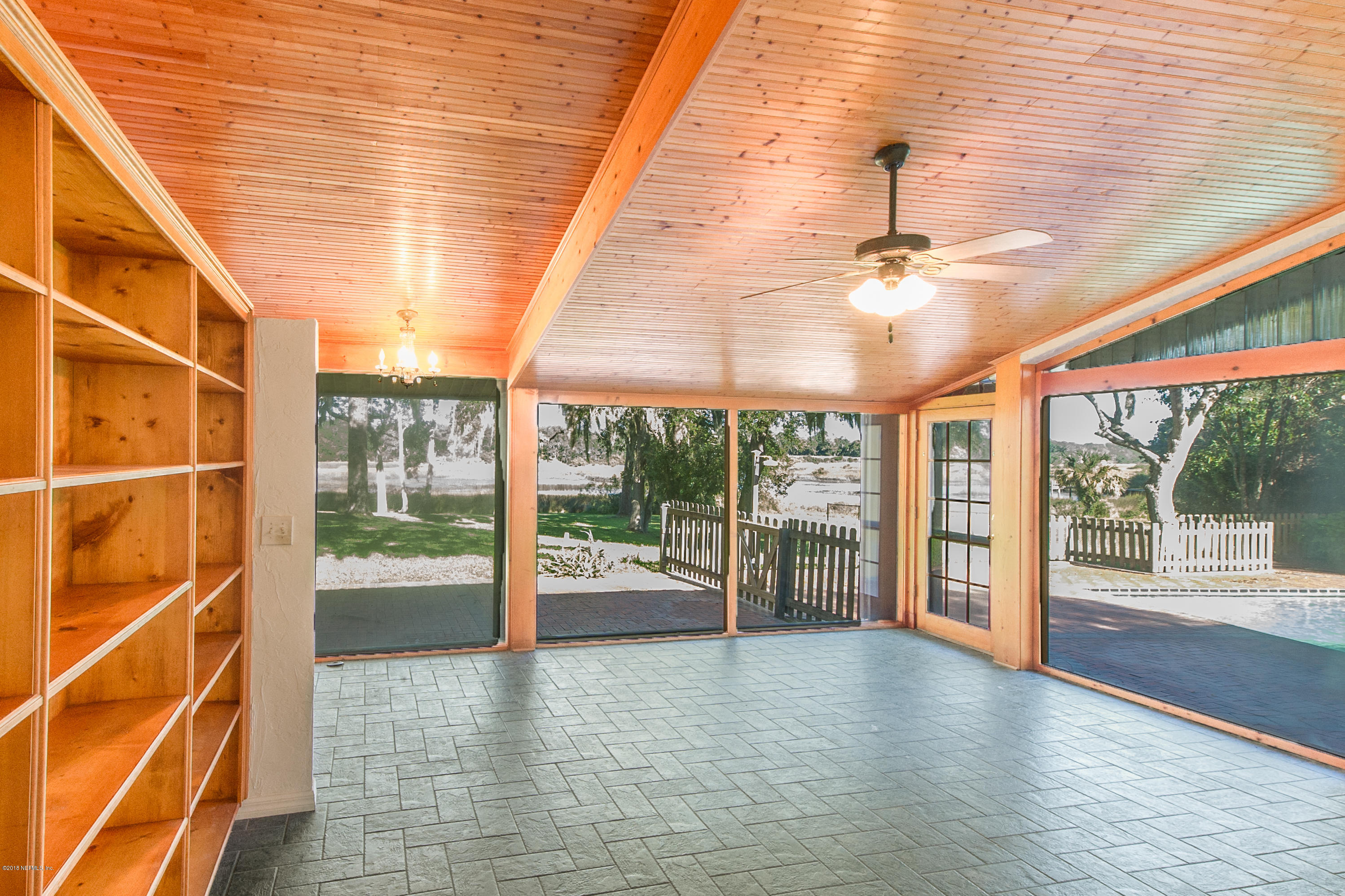 524 Vaill Point Road St. Augustine, FL 32086 - Photo 11 of 50 a view of an empty room with a balcony