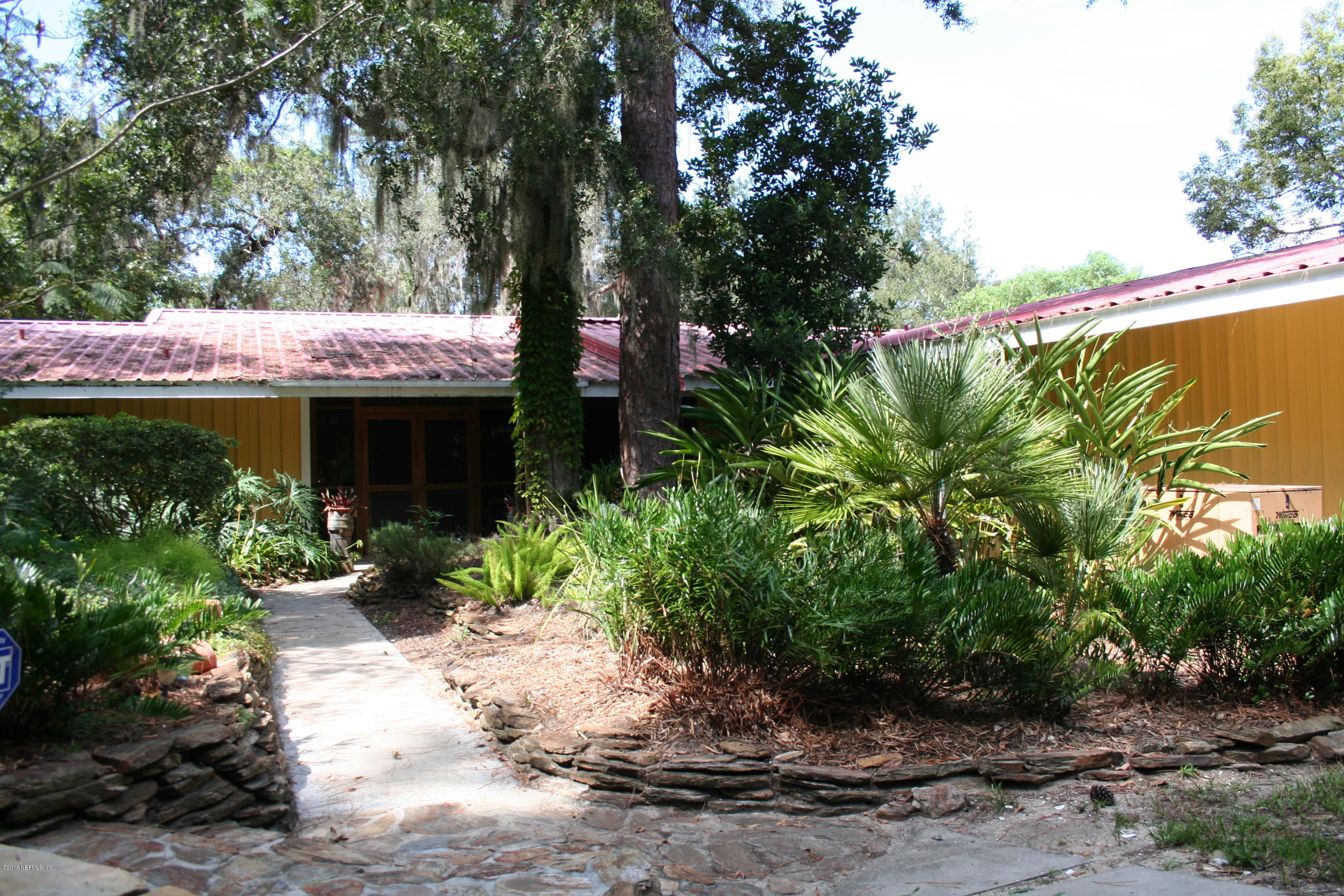 524 Vaill Point Road St. Augustine, FL 32086 - Photo 2 of 50 a view of a house with a yard and potted plants