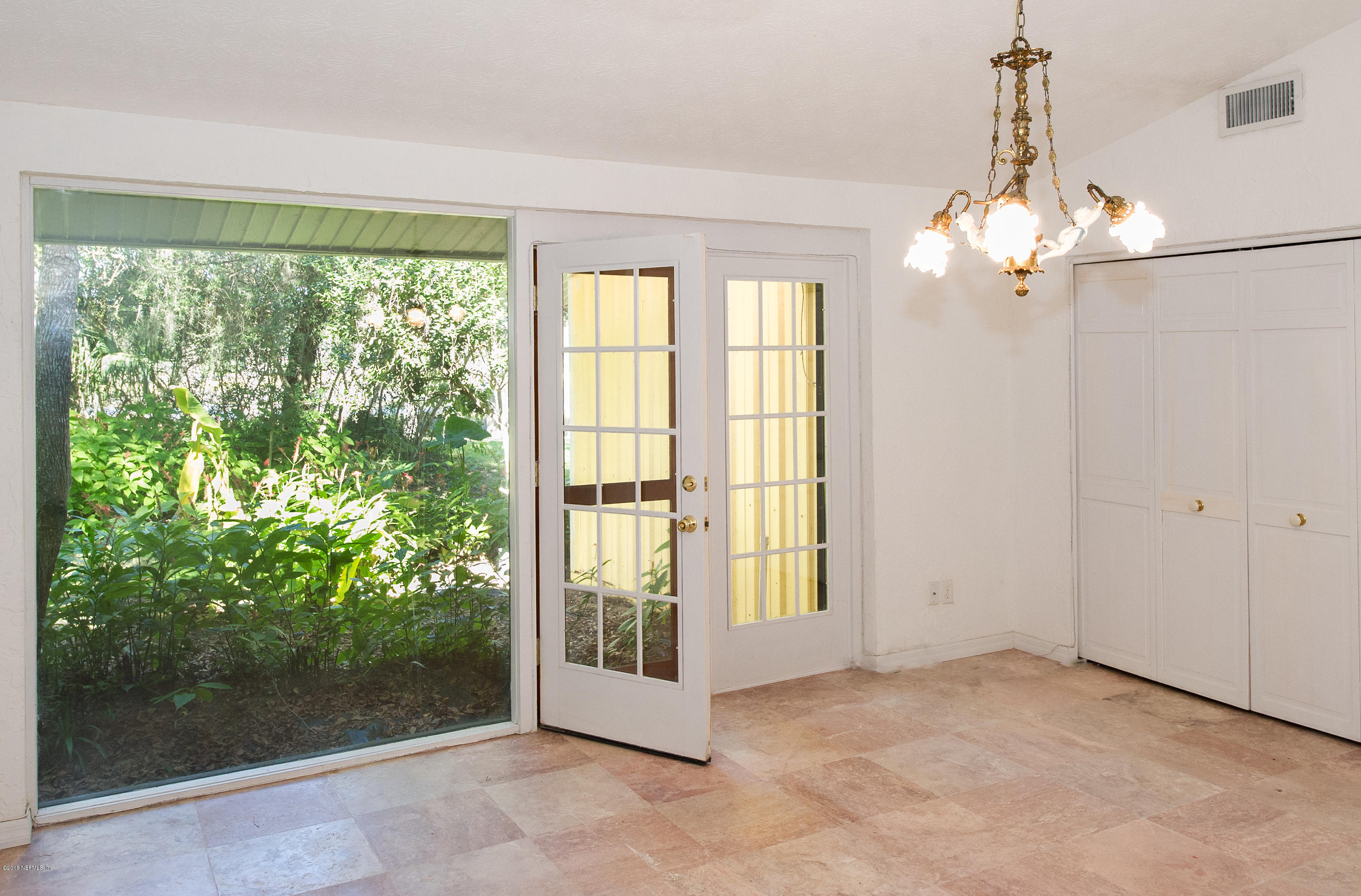 524 Vaill Point Road St. Augustine, FL 32086 - Photo 22 of 50 a view of an empty room with a window