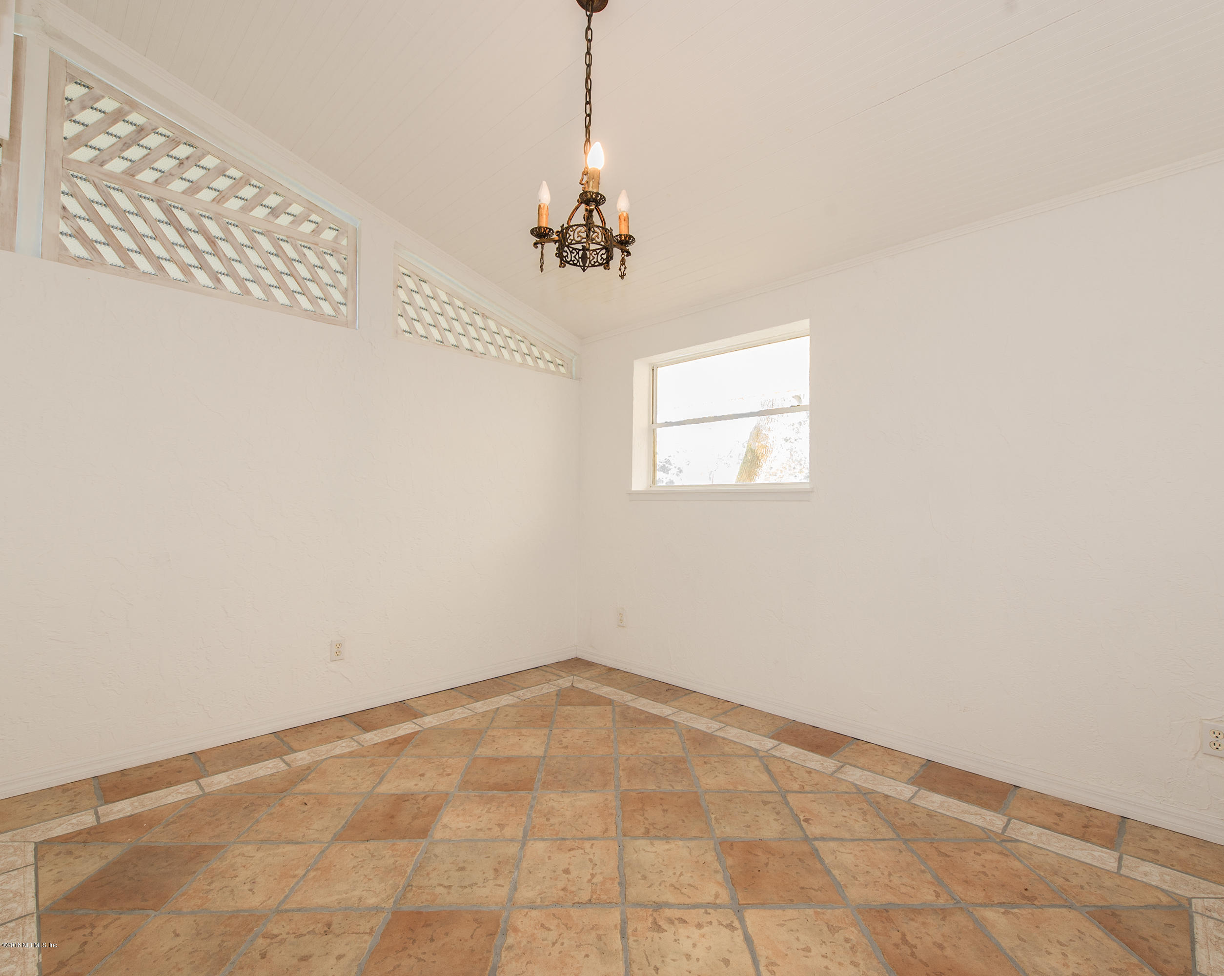 524 Vaill Point Road St. Augustine, FL 32086 - Photo 26 of 50 a view of a room with a chandelier fan